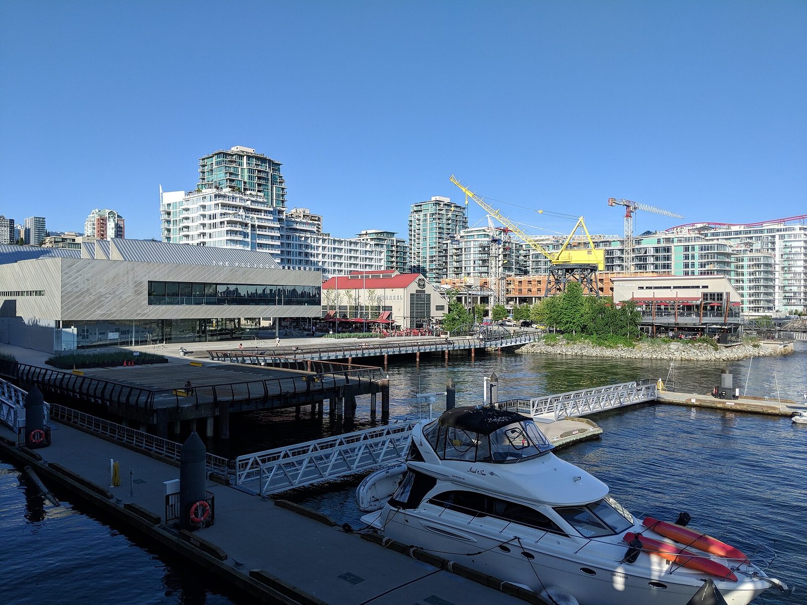 The Shipyards waterfront in North Vancouver seen from Lonsdale Quay, with the Polygon Gallery, marina and the old shipyard crane. The Pinnacle Hotel at the Pier sits on this stretch of waterfront.