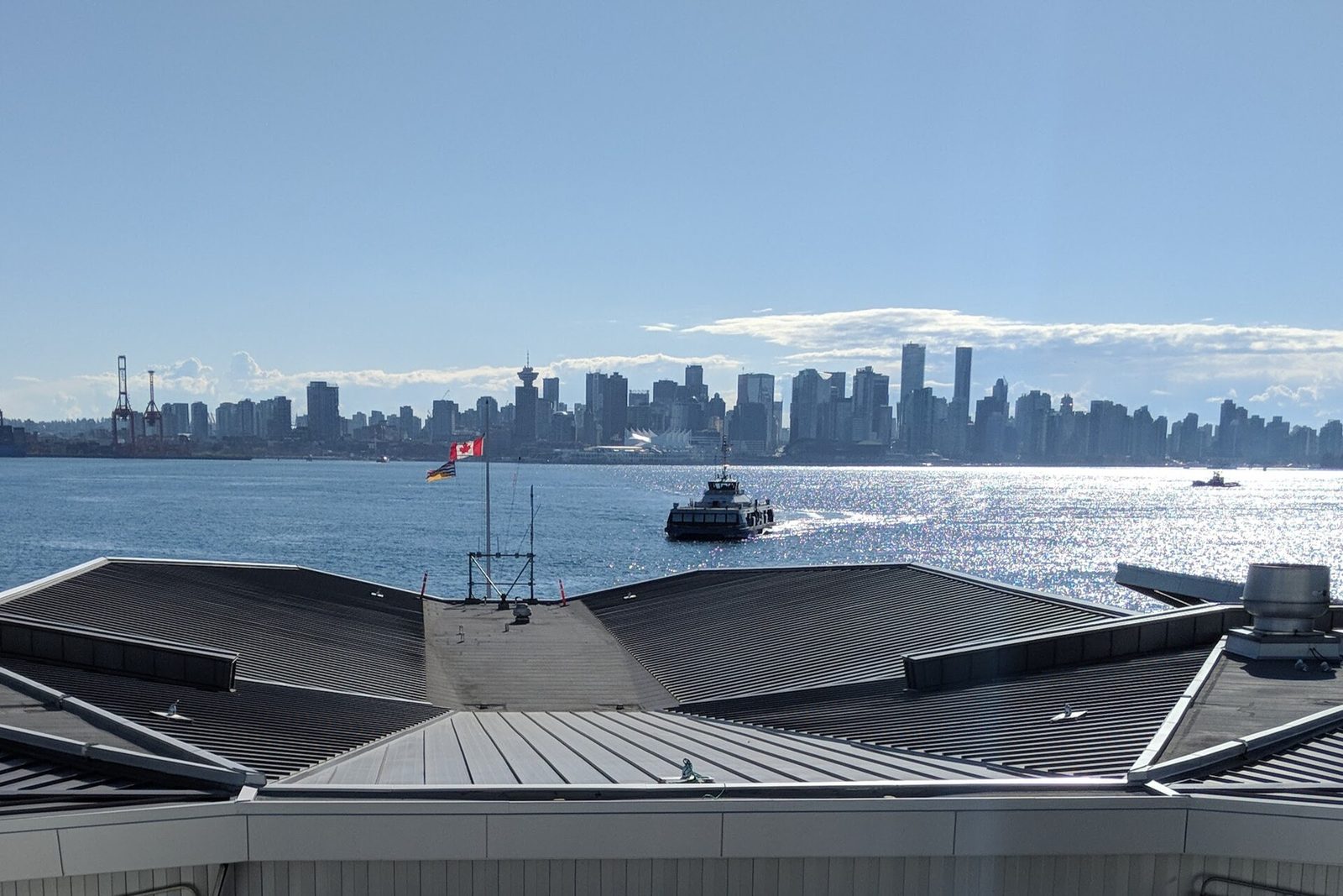 Lonsdale Quay in North Vancouver with downtown Vancouver across the water, a few minutes' walk from the Pinnacle Hotel at the Pier (surrounding area, not the hotel itself).